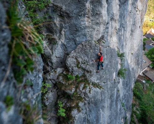 Rock Climber with Red T-shirt is Climbing near Lake Bled, Slovenia