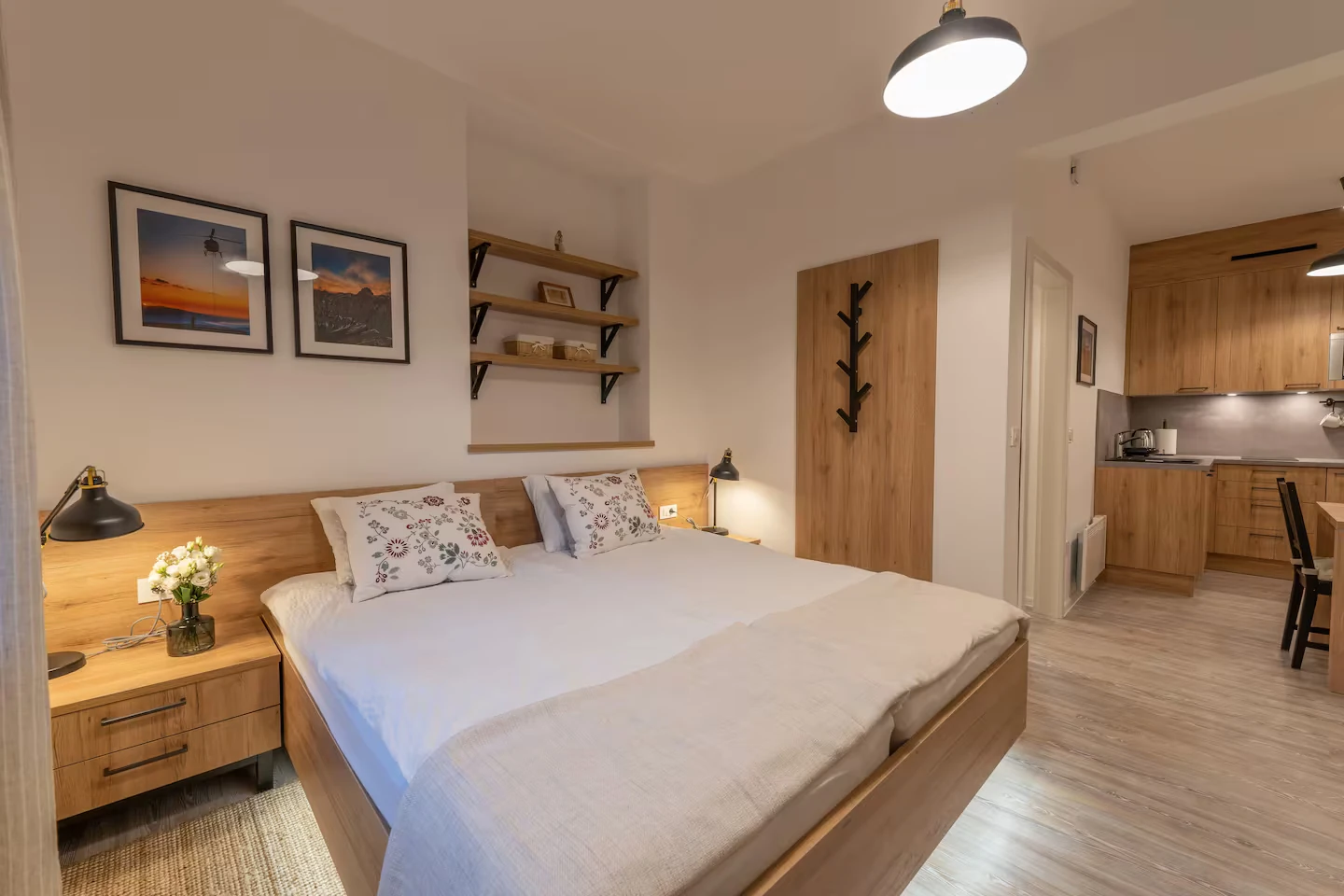 Cozy bedroom with white walls and wooden additions