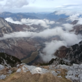 Aerial view of a mountain pass under the clouds