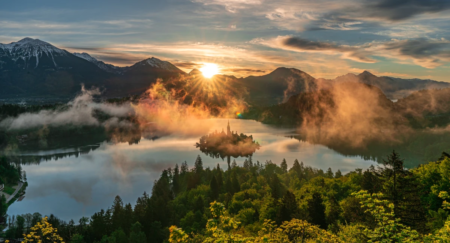 Sunset at Lake Bled with mountains behind
